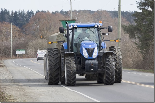 A nice blue tractor heading down Dyke Road &ndash; Courtenay