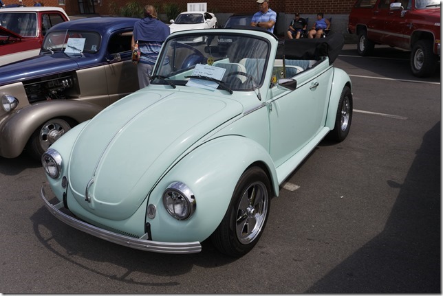 A Volkswagen Beetle convertible, and a camper van  at the Avon River Days Show & Shine, in Windsor Nova Scotia